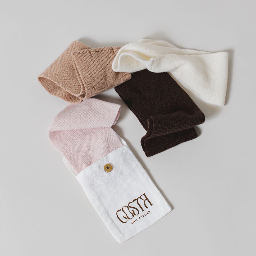 Flat lay of Costa Knit Atelier headbands featuring our signature care ritual, promoting longevity and intentional care for premium cashmere blend pieces.