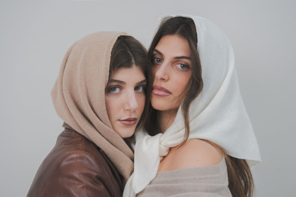 Models wearing the Costa Knit Atelier Triangle Scarf as a luxury headscarf, showcasing its versatile 90s-inspired silhouette and premium cashmere texture.
